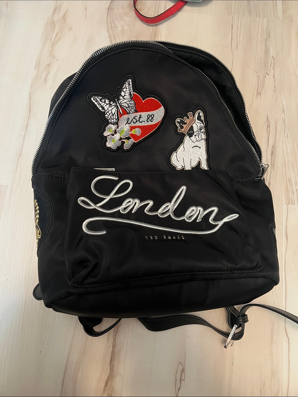 Ted Baker Black Backpack with Embroidered 'London' Script and Patches